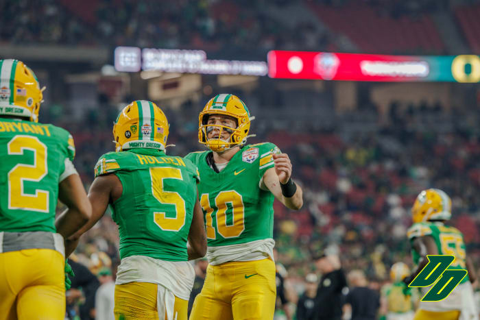 Oregon Ducks quarterback Bo Nix with wide receiver Traeshon Holden at the Vrbo Fiesta Bowl.